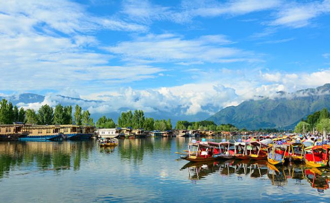 Srinagar, India - July 23, 2015: Many traditional boats waiting for tourists in the Dal lake of Srinagar, Jammu and Kashmir, India. Dal lake is integral to tourism and recreation in Kashmir.